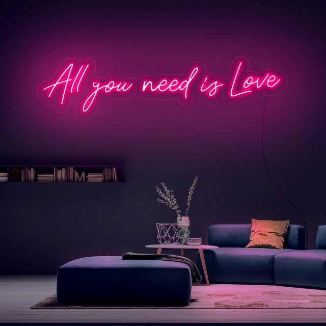 Néon LED mural rose avec citation "All you need is love"